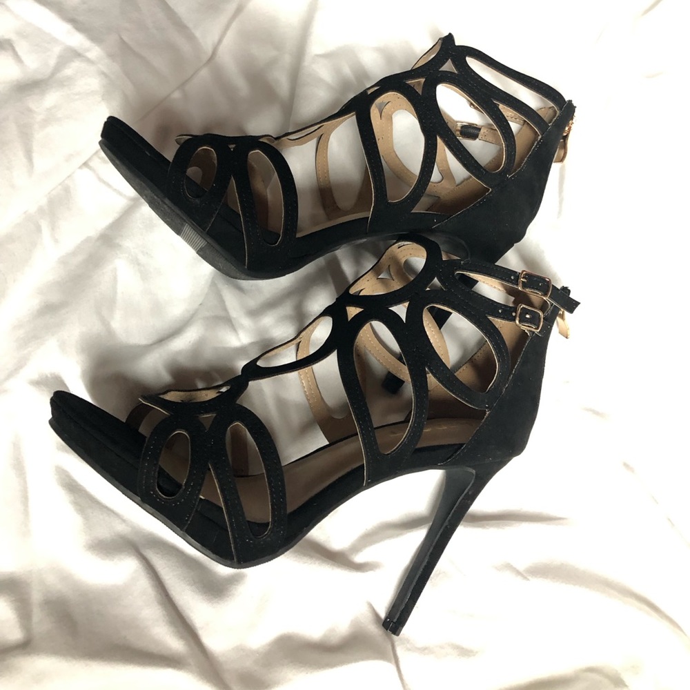 Womens black report heels.